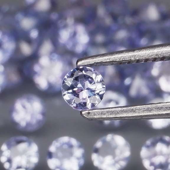 Heavy flashing 3.26ct diamond cut Tanzanite set