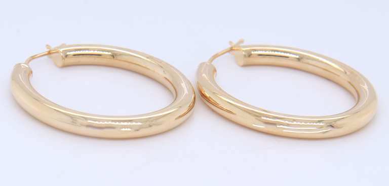 Beautiful Yellow Gold oval Tube Hoop Earrings