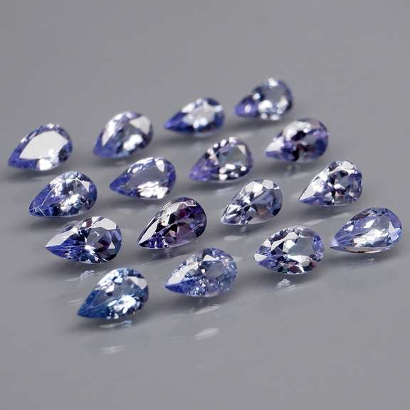 Heavy flashing 3.24ct pear cut Tanzanite set
