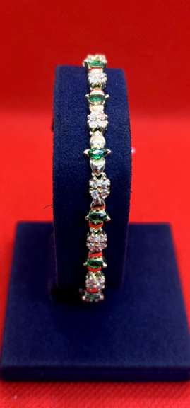 LADIES 14K YELLOW GOLD DIAMOND AND EMERALD BRACELET 