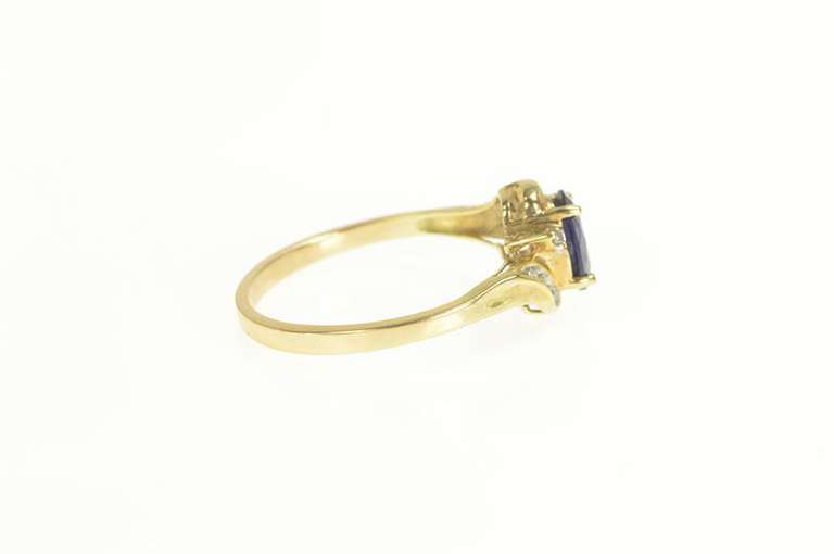 10K Yellow Gold Oval Syn. Sapphire Diamond Cluster Bypass Ring