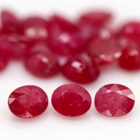 Vibrant 9.14ct oval cut imperial red Ruby set