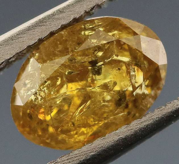 Incredible .69ct oval cut golden Diamond