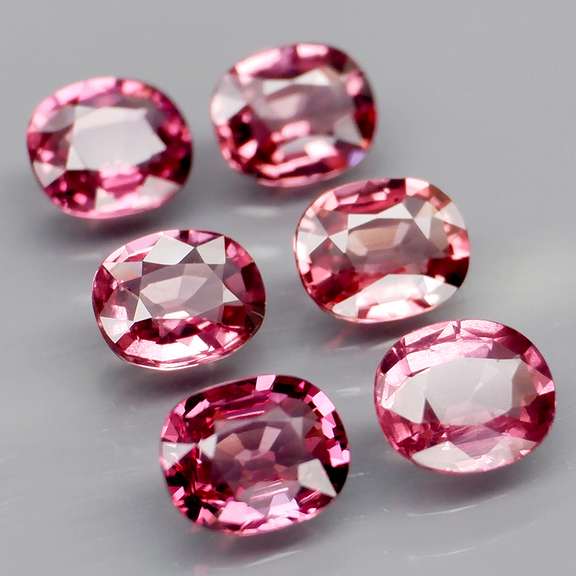 Amazing 4.46ct oval cut violet red Garnet set