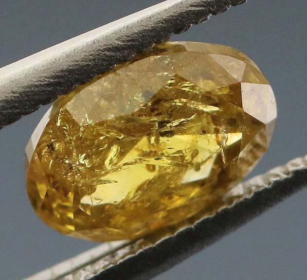 Incredible .69ct oval cut golden Diamond