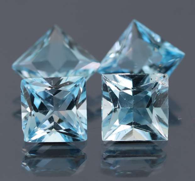 4 piece 21.92ct glittering sky blue Topaz set