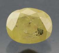 Eye catching .57ct oval cut yellow Diamond