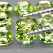 Dazzling 7.37ct untreated apple green Peridot set