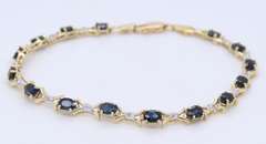 Fantastic Yellow Gold Oval Blue Sapphire and Diamond X Bracelet