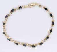 Fantastic Yellow Gold Oval Blue Sapphire and Diamond X Bracelet