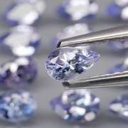 Heavy flashing 3.24ct pear cut Tanzanite set