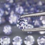 Heavy flashing 3.26ct diamond cut Tanzanite set