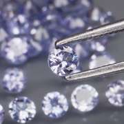 Heavy flashing 3.24ct diamond cut Tanzanite set