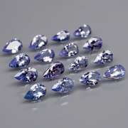 Heavy flashing 3.24ct pear cut Tanzanite set