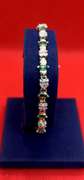 LADIES 14K YELLOW GOLD DIAMOND AND EMERALD BRACELET 