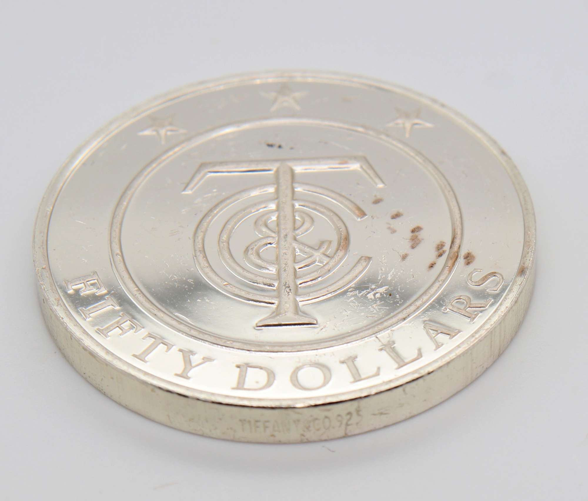 Retired Tiffany & Co $50 Coin - U.S. Auction Brokers