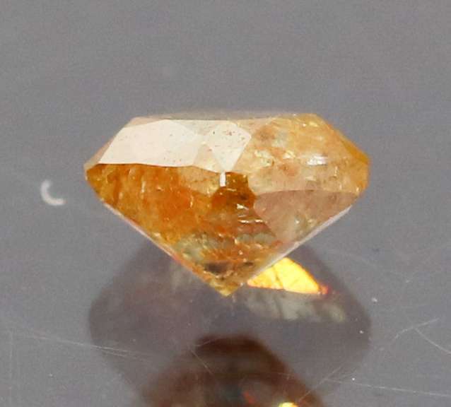 Stunning .27ct cushion cut red orange Diamond