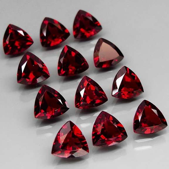 Premium 11.05ct trillion cut cherry red Garnet set