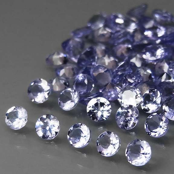 Heavy flashing 4.86ct diamond cut Tanzanite set
