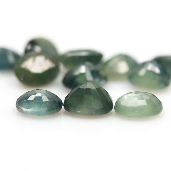 Heated only! 5.47ct blue green Sapphire set