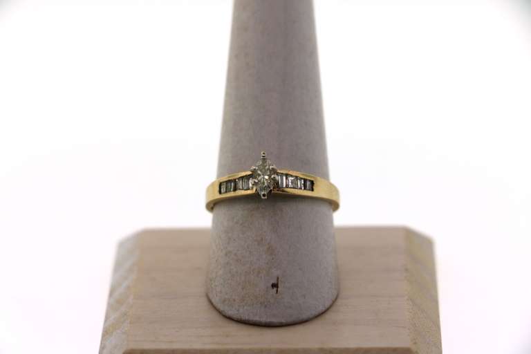 Classic Solitaire 14k Gold Diamond Ring with channel set Baguette Diamond