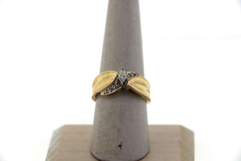 Channel Set Diamonds Intercrossed with Oval Diamond Centerpiece Ring with 14k Gold