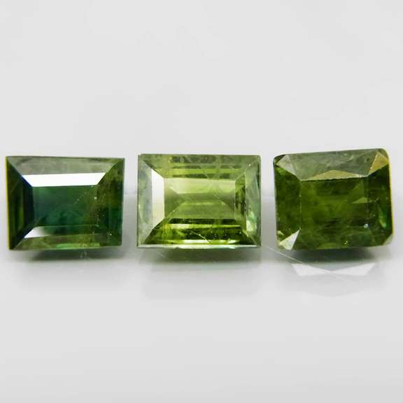 Exotic 2.99ct 3pc matched baguette cut green Sapphire set