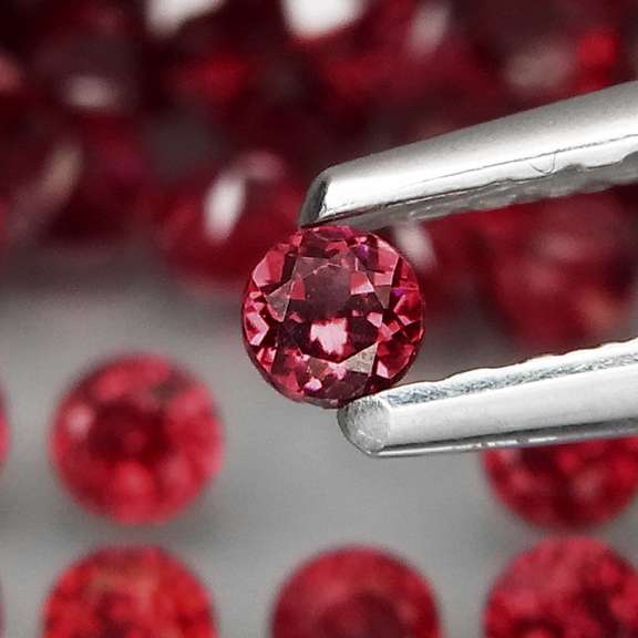 Incredible 7.11ct open color Pyrope Garnet set
