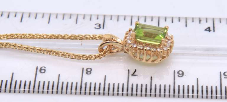 Stunning Yellow Gold Peridot and Diamond Halo Necklace