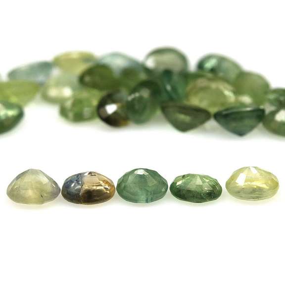 Heated only! 7.42ct oval cut green Sapphire set