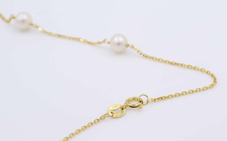 Elegant 5.5mm Pearl Station Yellow Gold Necklace