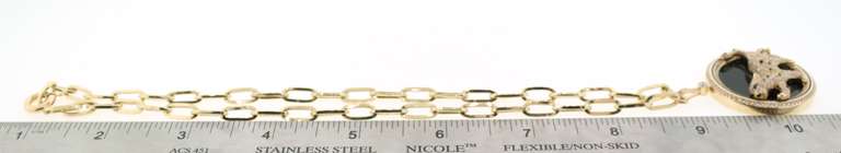 Glimmering 14k Gold Handmade Italian Panther Necklace studded with Cubic Zirconias against Pure Onyx