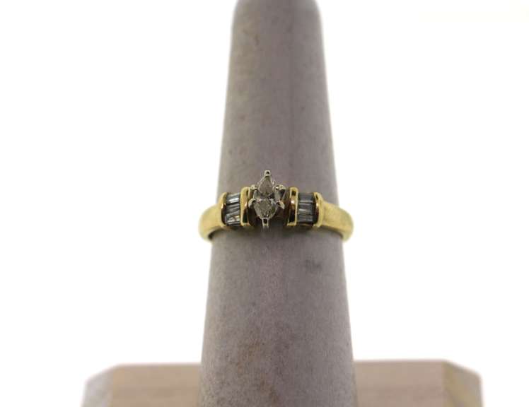 Oval Diamond Ring with Baguette Diamonds and 14k Gold Band