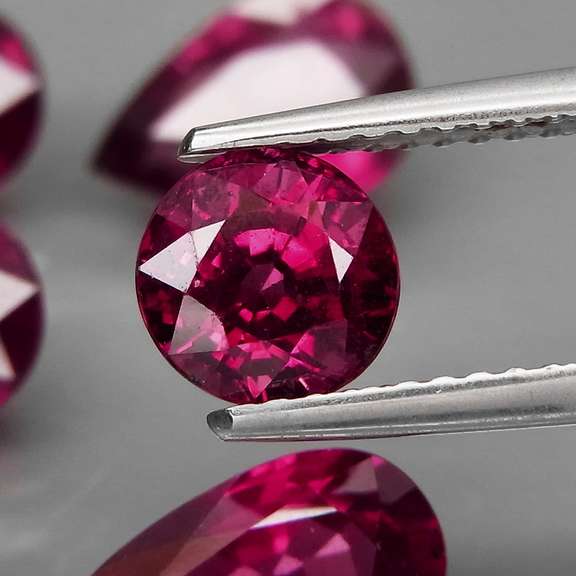 Mixed cut 9.46ct premium cherry pink Rhodolite Garnet set