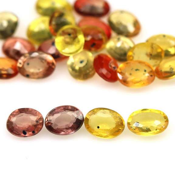 8.29ct heated only Autumn leaves Sapphire set