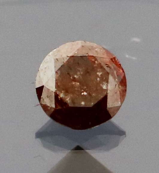 Eye catching 0.22ct round cut red Diamond solitaire