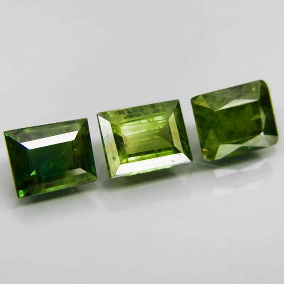 Exotic 2.99ct 3pc matched baguette cut green Sapphire set