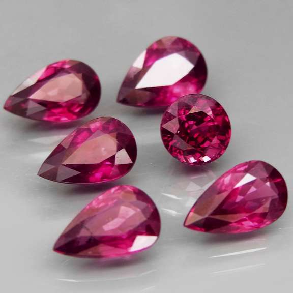 Mixed cut 9.46ct premium cherry pink Rhodolite Garnet set