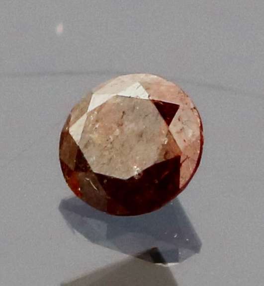 Eye catching 0.22ct round cut red Diamond solitaire