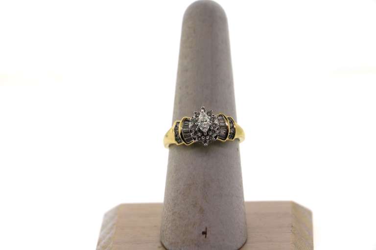 Exquisite Oval Diamond Halo Ring with Baguette Diamonds and a 14k Gold Band