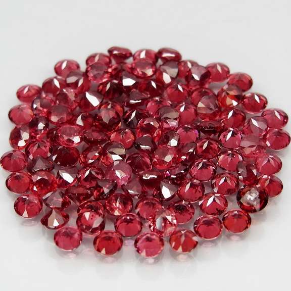 Incredible 7.11ct open color Pyrope Garnet set