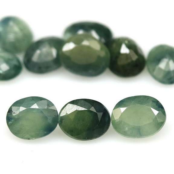 Heated only! 5ct green Sapphire set