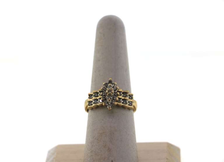 Impeccable Diamond Cluster Ring with Side Stones layered on a 14k Gold Band