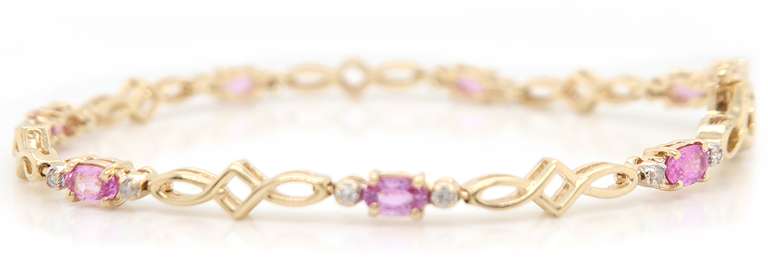 Handsome Yellow Gold pink Sapphire and Diamond Tennis Bracelet