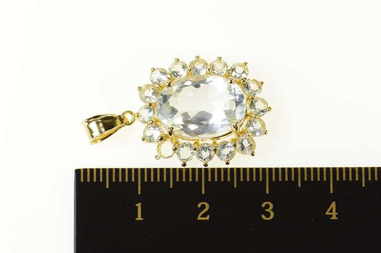14K Yellow Gold Oval Syn. Blue Topaz Halo Statement Pendant