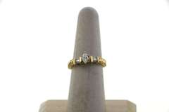 Brilliant Oval Diamond Ring flanked by Baguette Diamonds on a 14k Gold Band