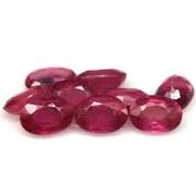 Vibrant 9.33ct oval cut reddish pink Ruby set