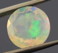 Highly expressive glittering 2.69ct faceted Jelly Opal