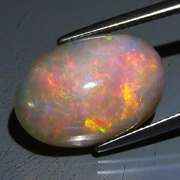 Smoldering 8.07ct full cover flashing Welo Opal