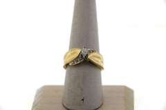 Channel Set Diamonds Intercrossed with Oval Diamond Centerpiece Ring with 14k Gold